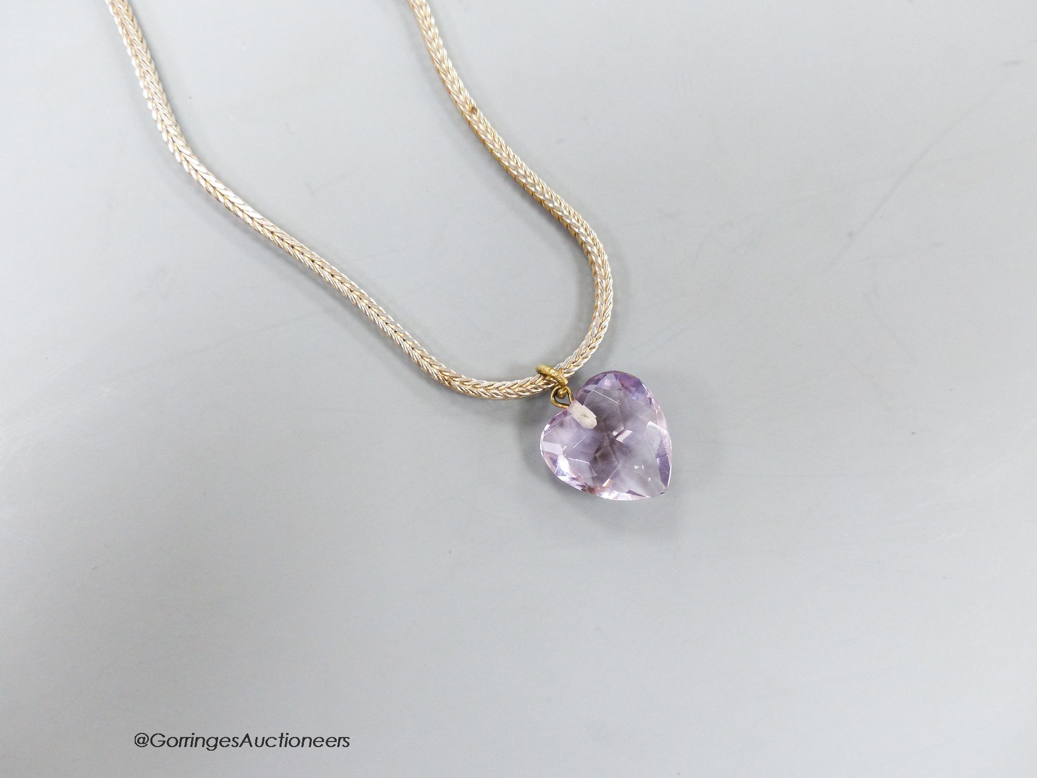 A heart shaped facet cut amethyst pendant, 15mm, on a modern 925 chain.